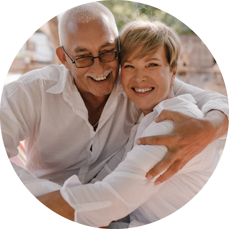 Age-Brightly-MindThrive-programme-circles-happy-older-couple-on-holiday-sitting-together-mobile