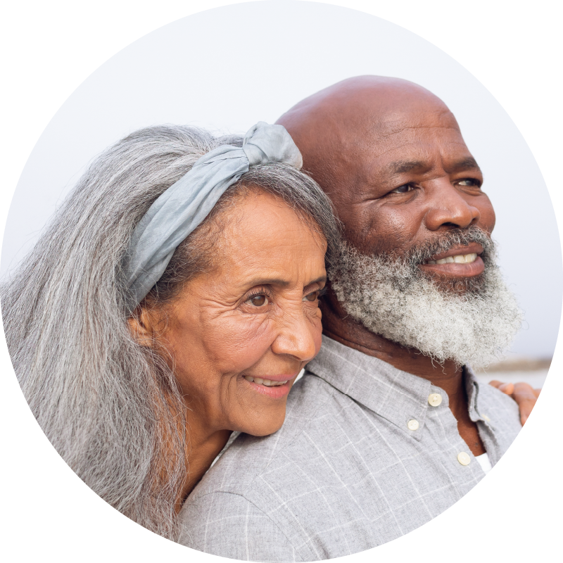 Age-Brightly-couple-smiling-beach-mobile-1