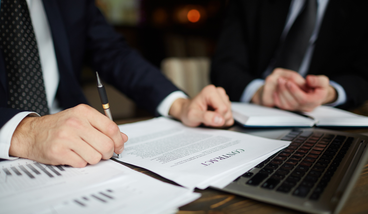 Brightly-Biomarkers-businessman-reading-contract-closeup