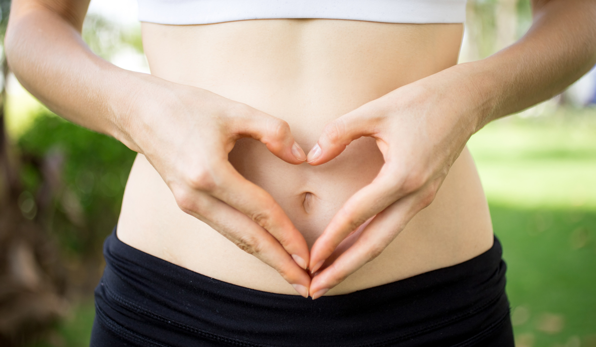 Brightly-Biomarkers-close-up-female-hands-shaping-heart-belly