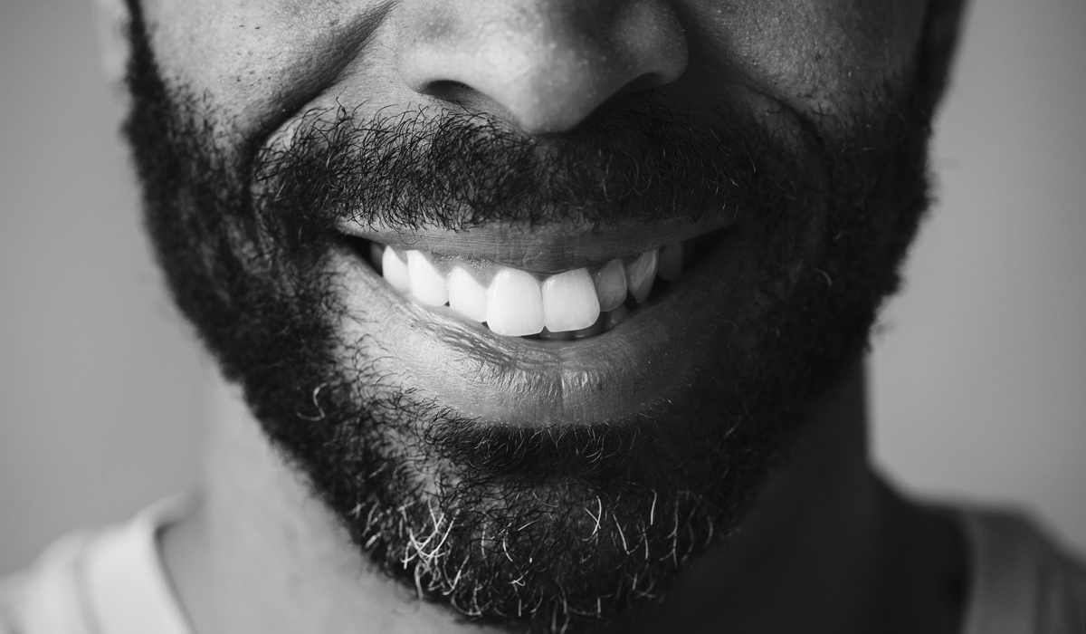 Brightly-Biomarkers-closeup-smiling-teeth-man