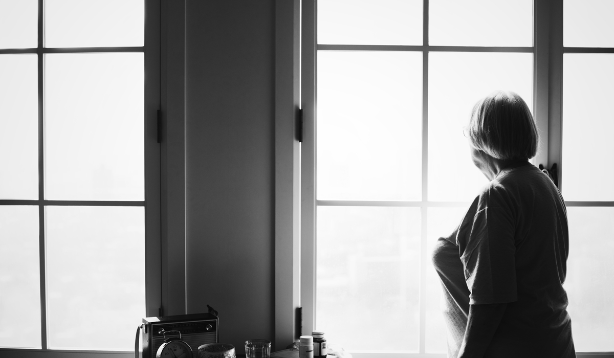 Brightly-Biomarkers-senior-woman-standing-alone-home