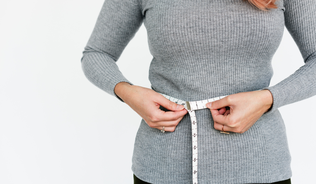 Brightly-Biomarkers-woman-measuring-her-waist